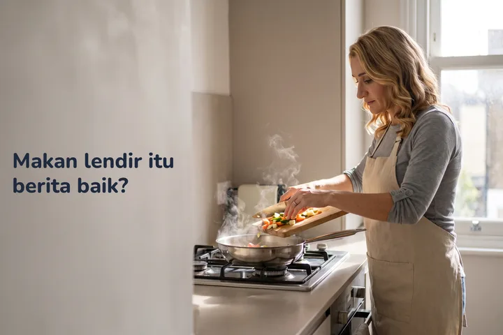 Makan lendir itu berita baik? — seorang wanita 40-an menuang sayur yang dihiris ke dalam kuali di dapur paginya