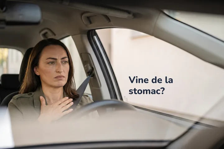 Vine de la stomac? — o femeie în mașina parcată, spre prânz, cu palma întinsă pe stomac